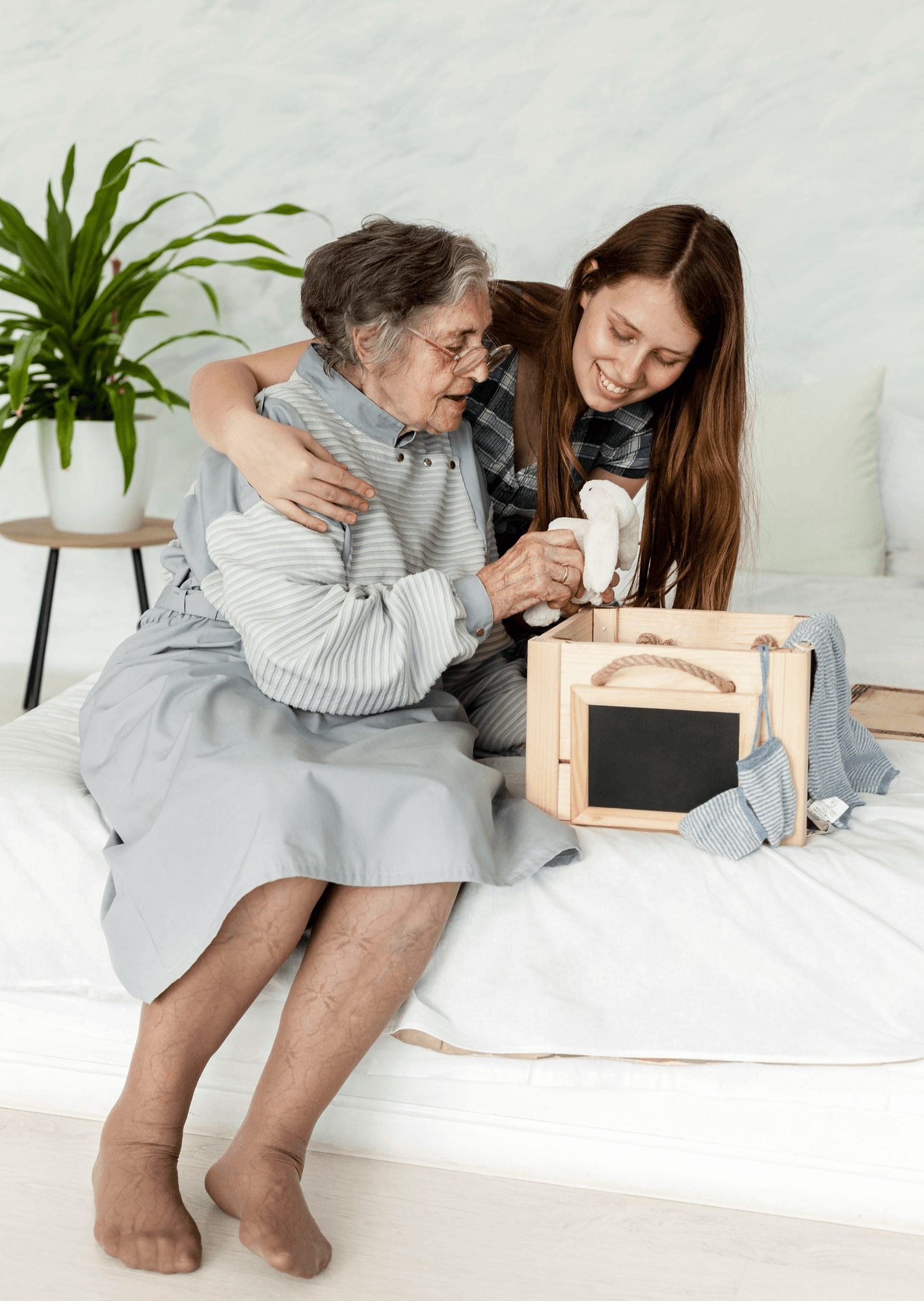 A family visiting an older adult at Palm Grove