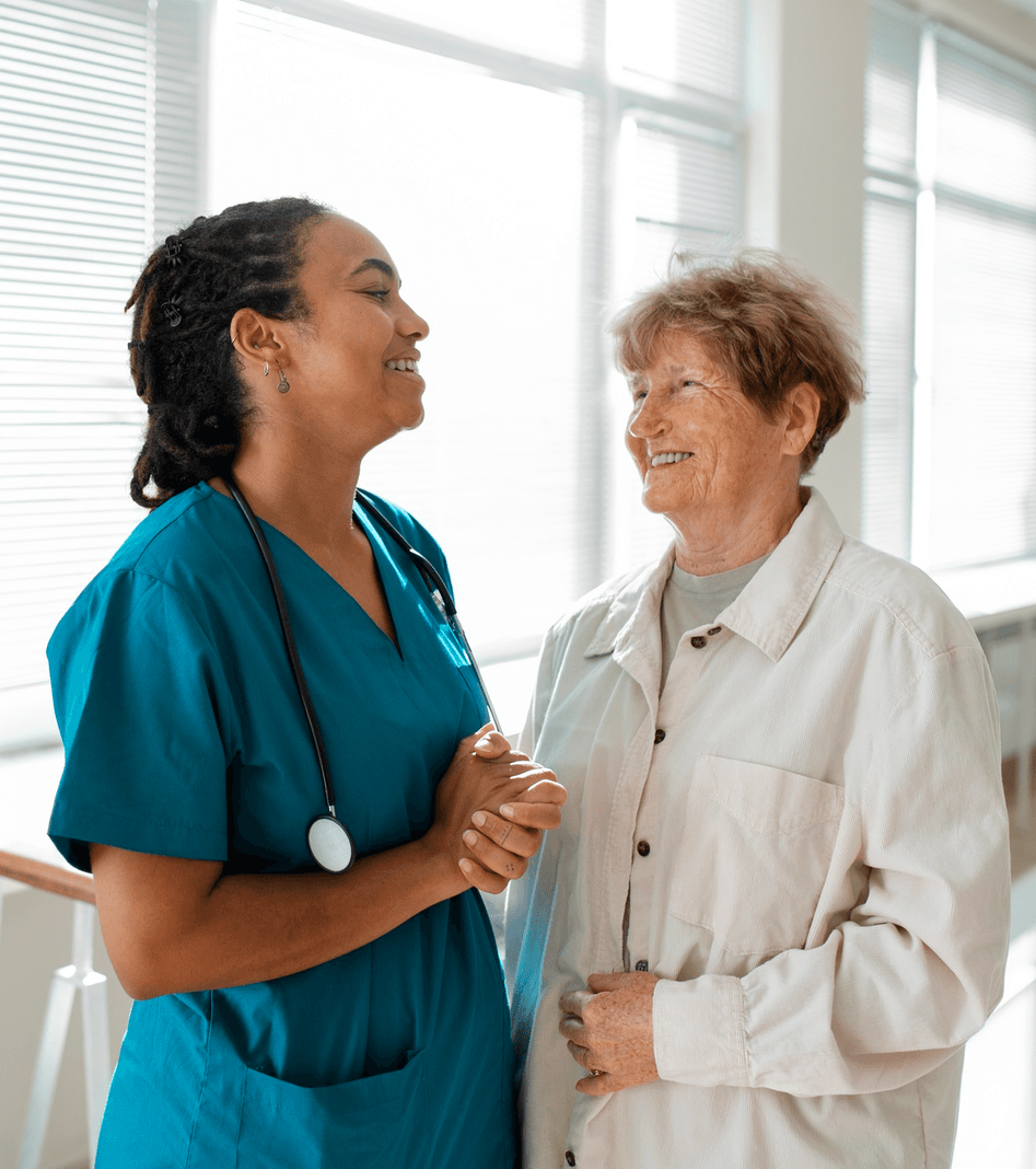 A nurse checking in with an older adult patient